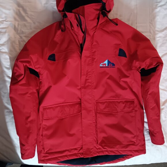 The iconic Abercrombie & Kent expedition red winter coat with blue lining. - Picture 2 of 10